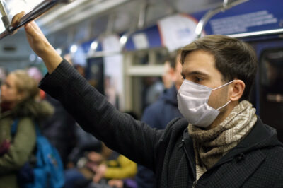 Masked People Metro. Coronavirus. Corona Virus. Covid-19. 2019-ncov. SARS-CoV-2. COVID-19 – a commuter ewaring a mask (photo from Getty)