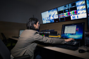 A television editor working with vision mixer - Getty Images photo