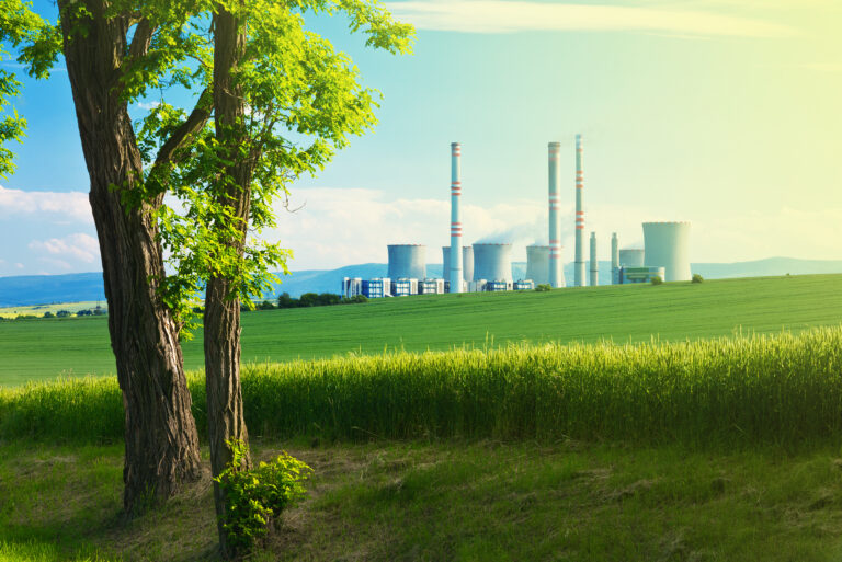 landscape with a tree and power station