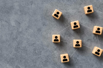 GettyImages-1249409146-2048x910 A connection of wooden blocks with people on them