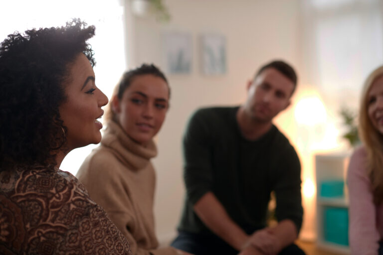 Woman talking to support group
