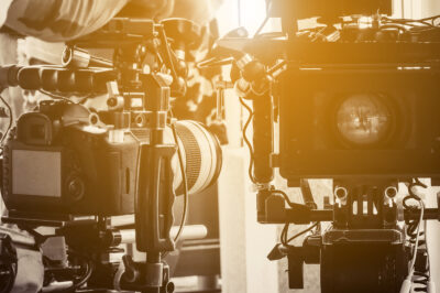 two cameras bathed in sunlight