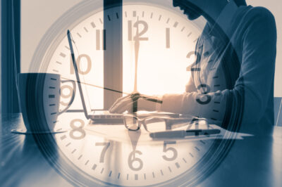 Person working in office around the clock concept.